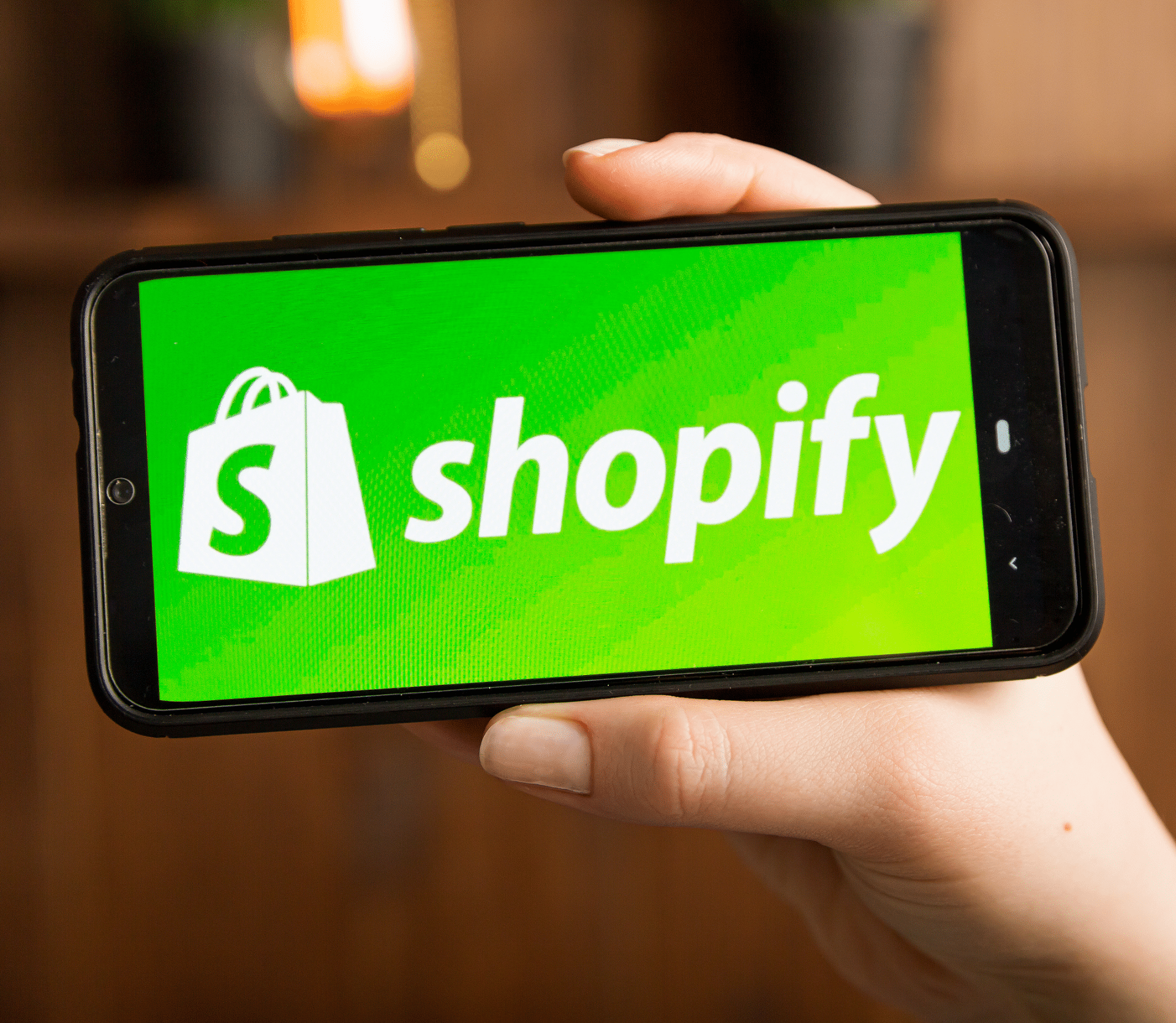 Shopify app displayed on a mobile phone