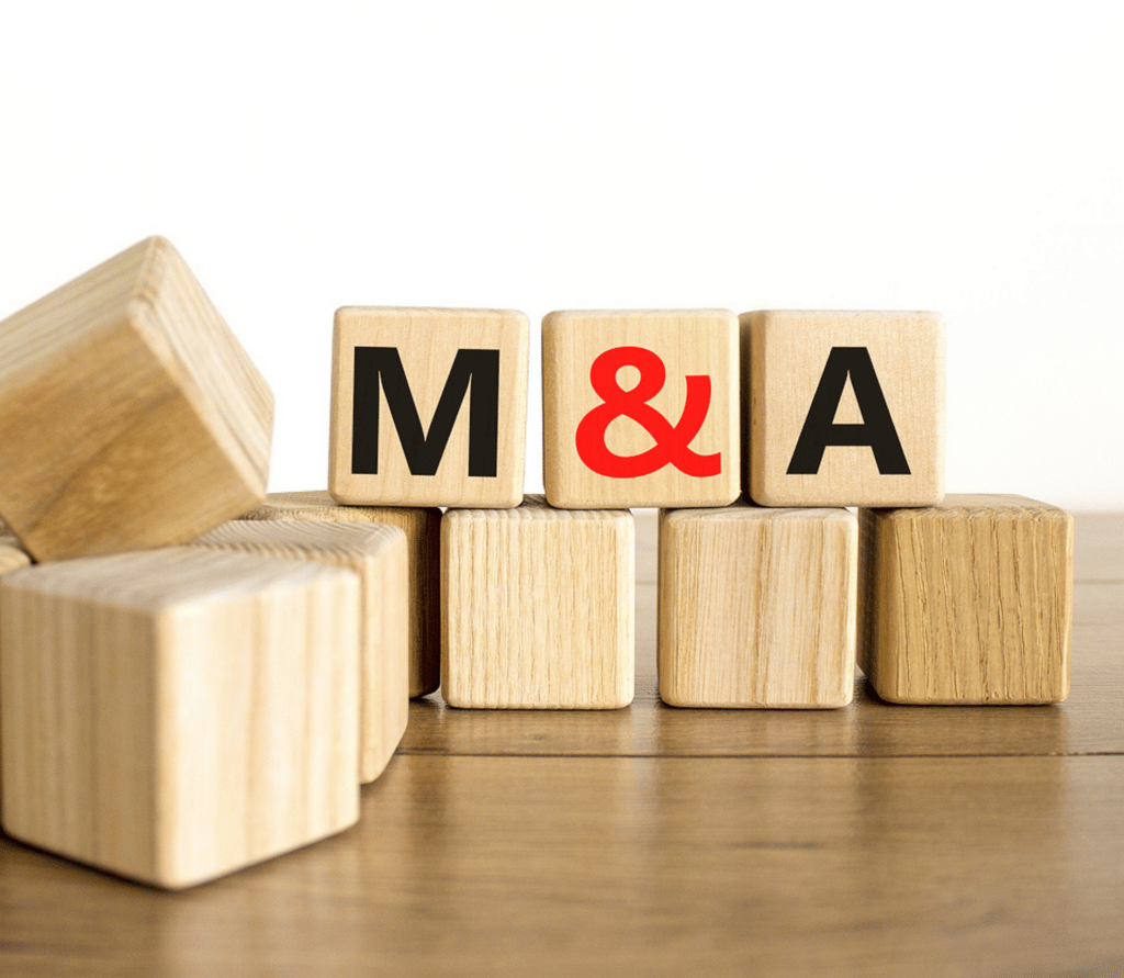 Wood blocks with the initials M & A for subscription industry mergers and acquisitions.