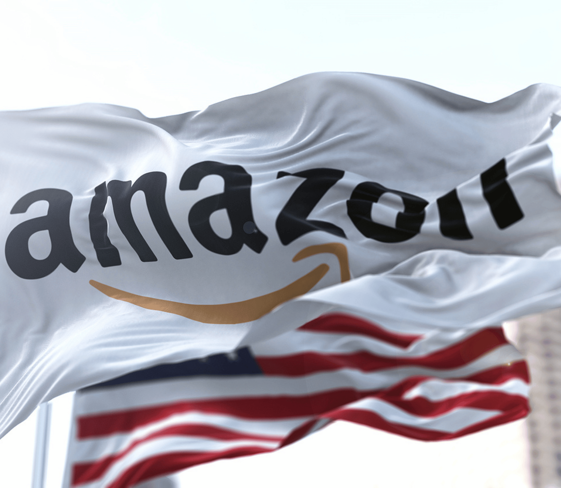 Amazon flag hangs in front of the American flag