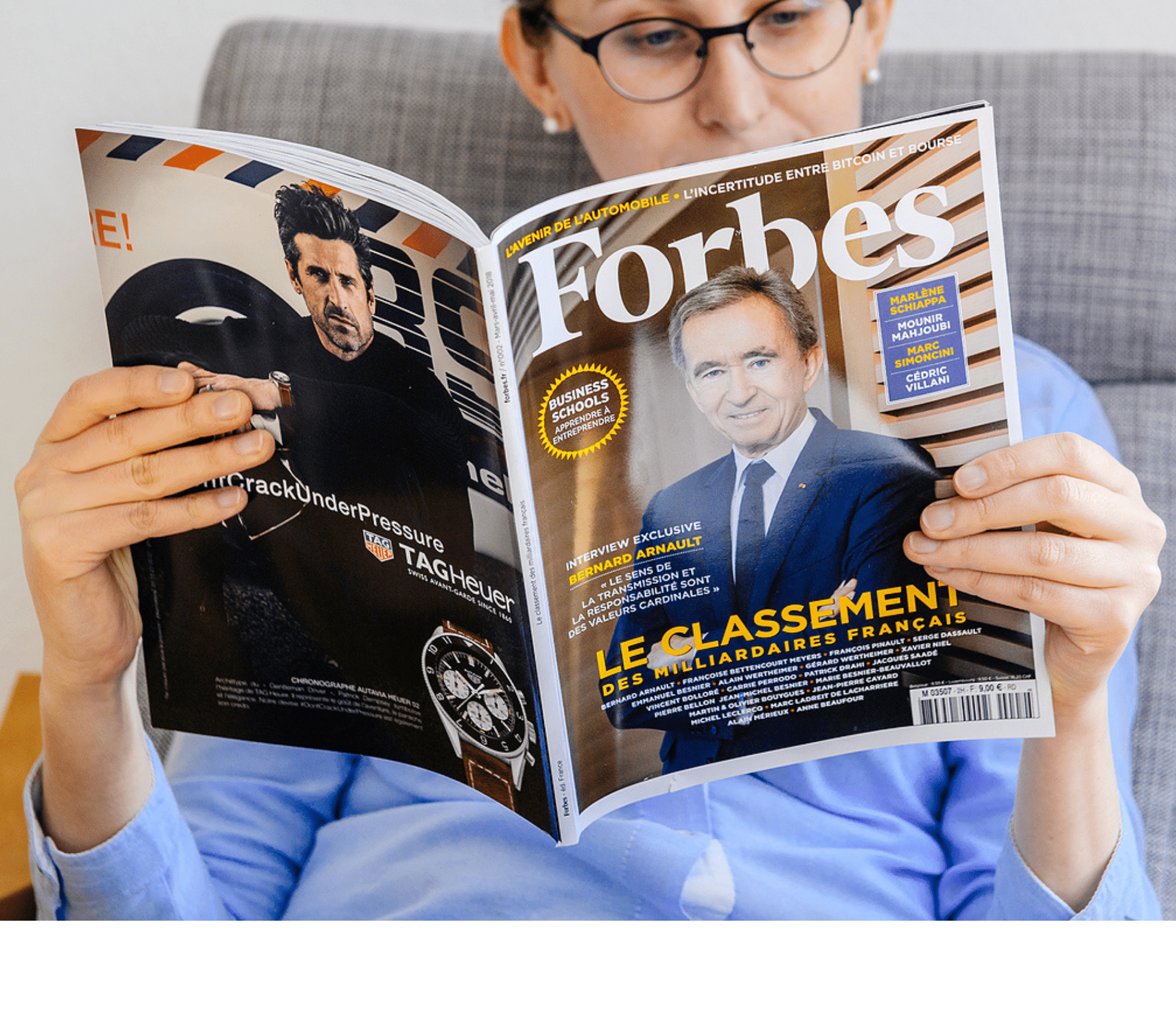 woman reading a Forbes magazine