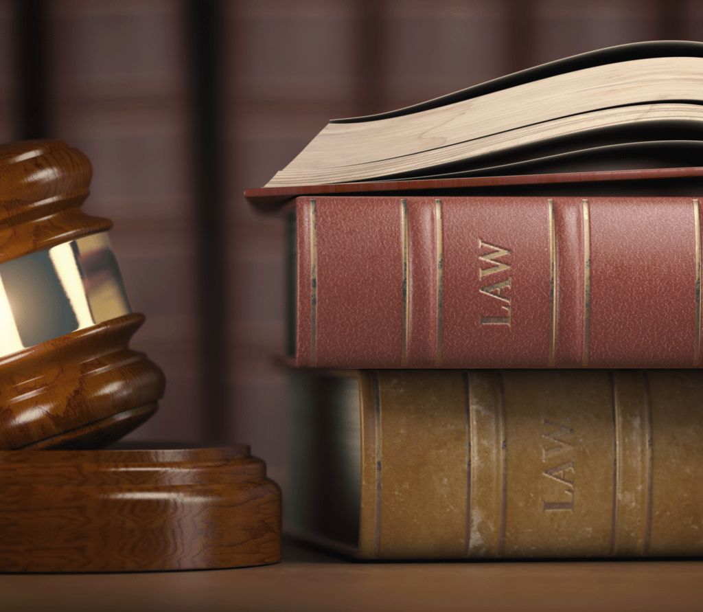 Gavel and law books on table in law library