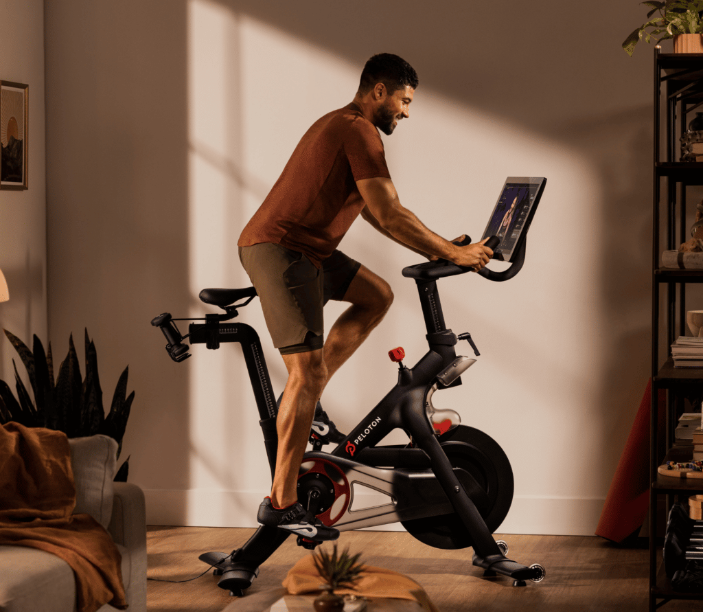 Man sits on Peloton bike