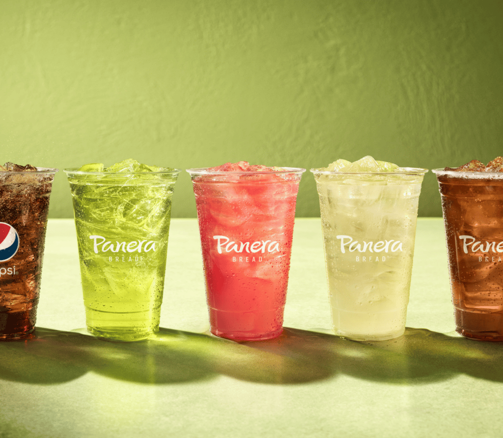 Line up of Panera drinks on green background