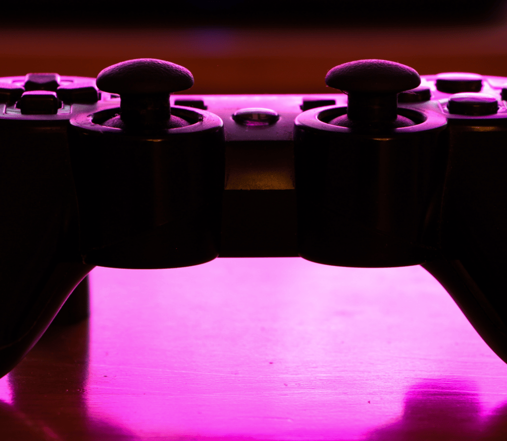 PlayStation controller on fuschia background