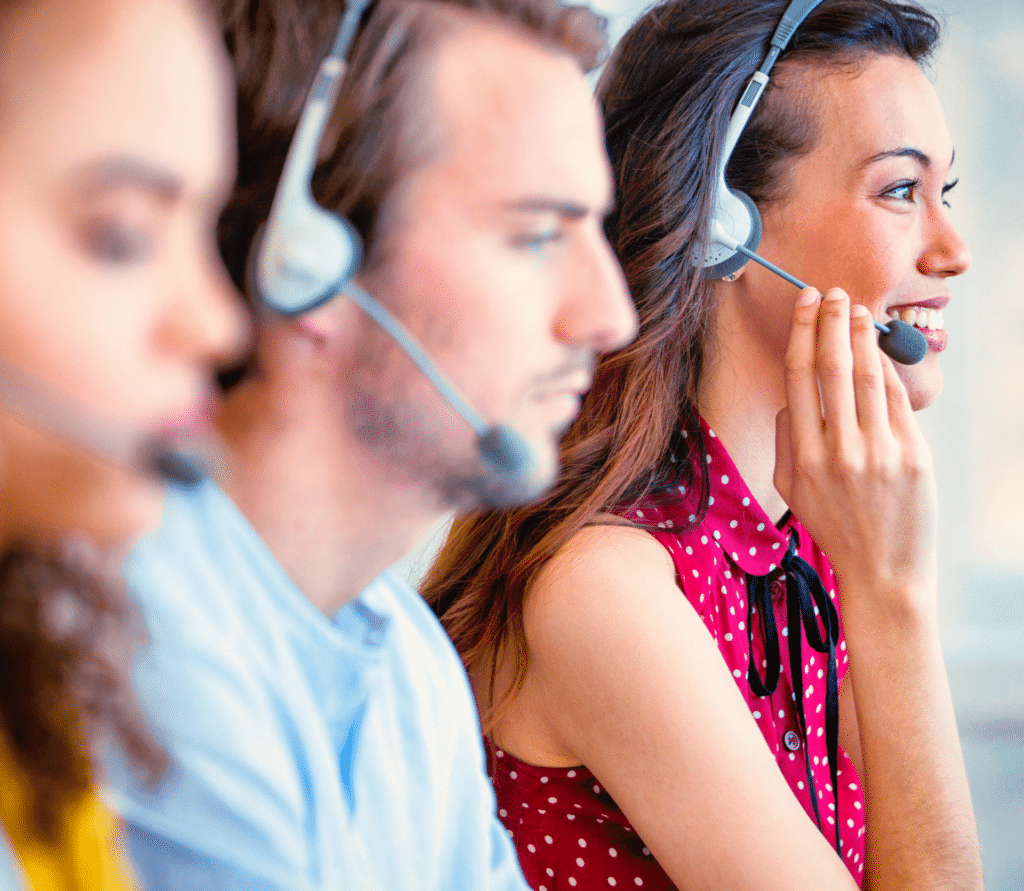 Three customer service reps on the phone with customers