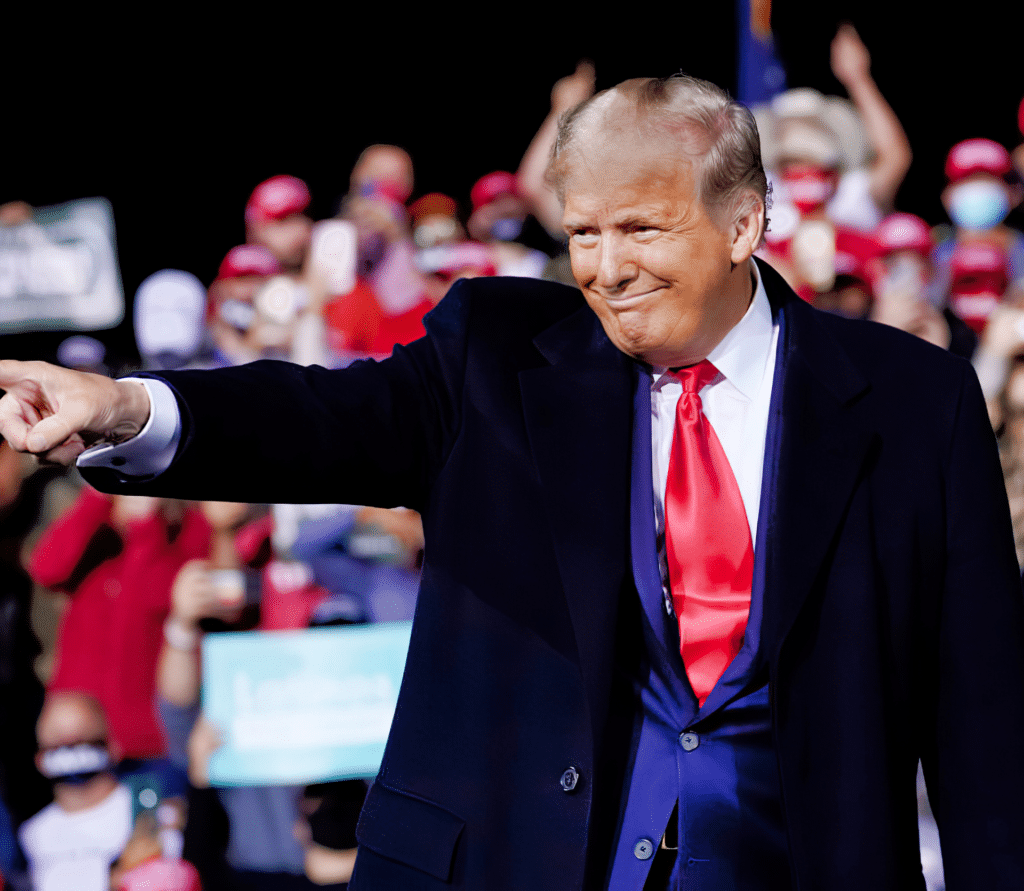 Donald Trump pointing during a campaign event.