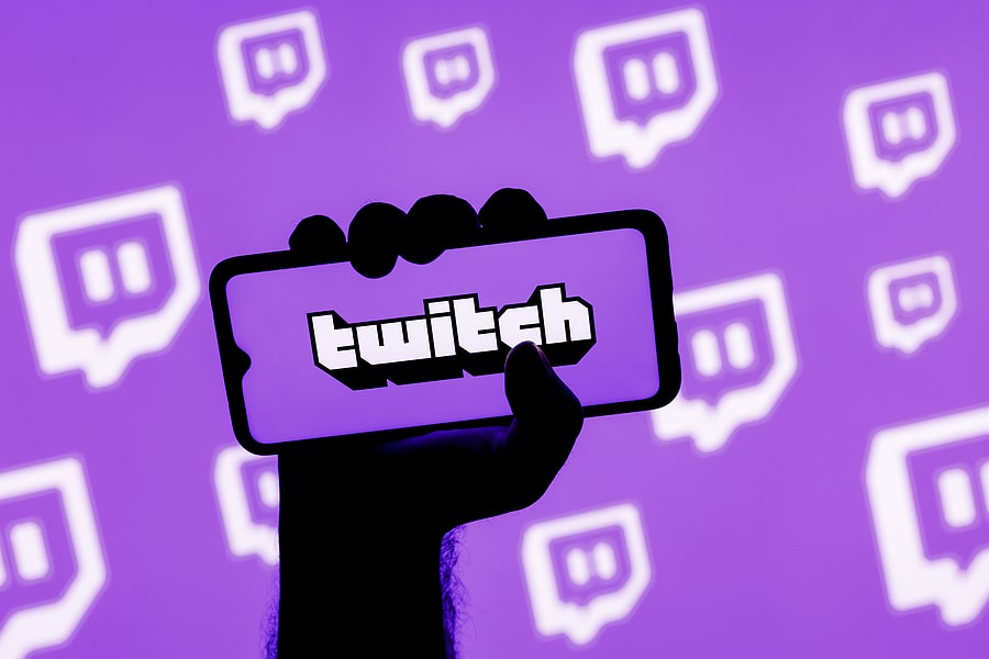 Twitch logo displayed on smartphone with purple background