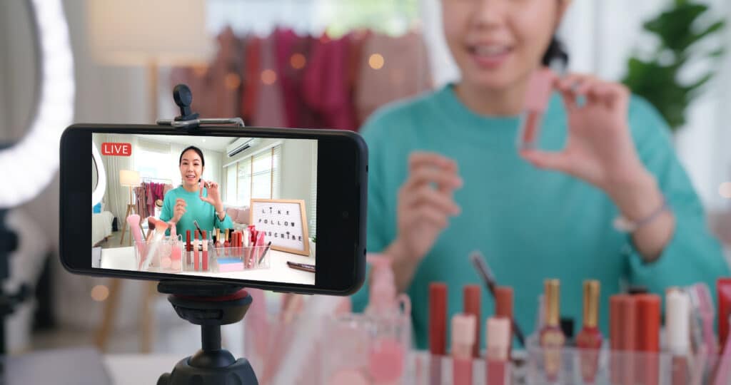 Asia woman micro influencer record live viral video camera at home studio. Happy fun talk speak advice review hobby in media. Vlogger selfie shoot enjoy work show smile teach like share app.