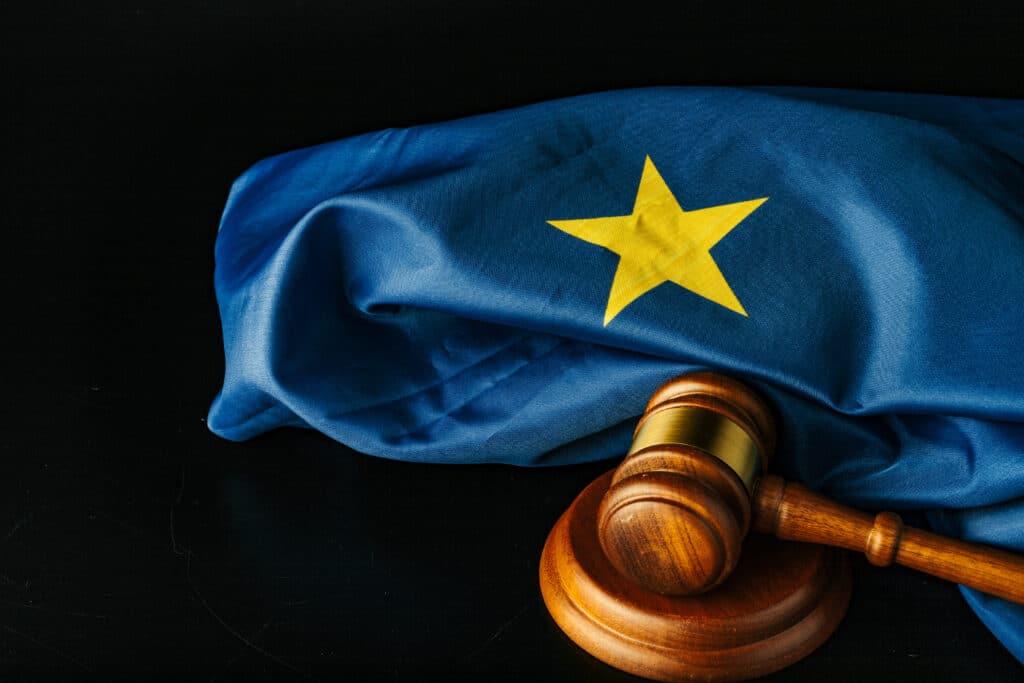 European Union flag and gavel on black background