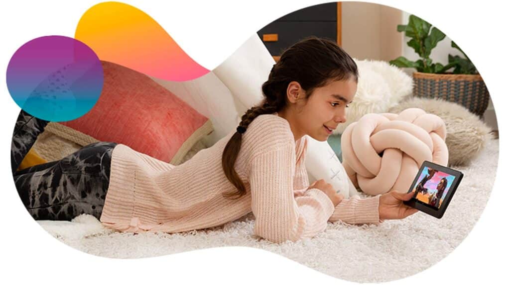 Girl lying on a rug looking at Amazon Kids+ programming on a smartphone