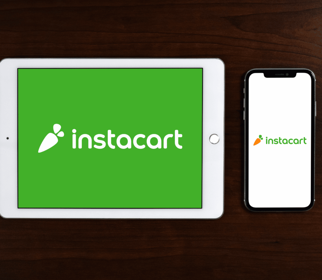 Instacart logos displayed on a tablet and a smartphone