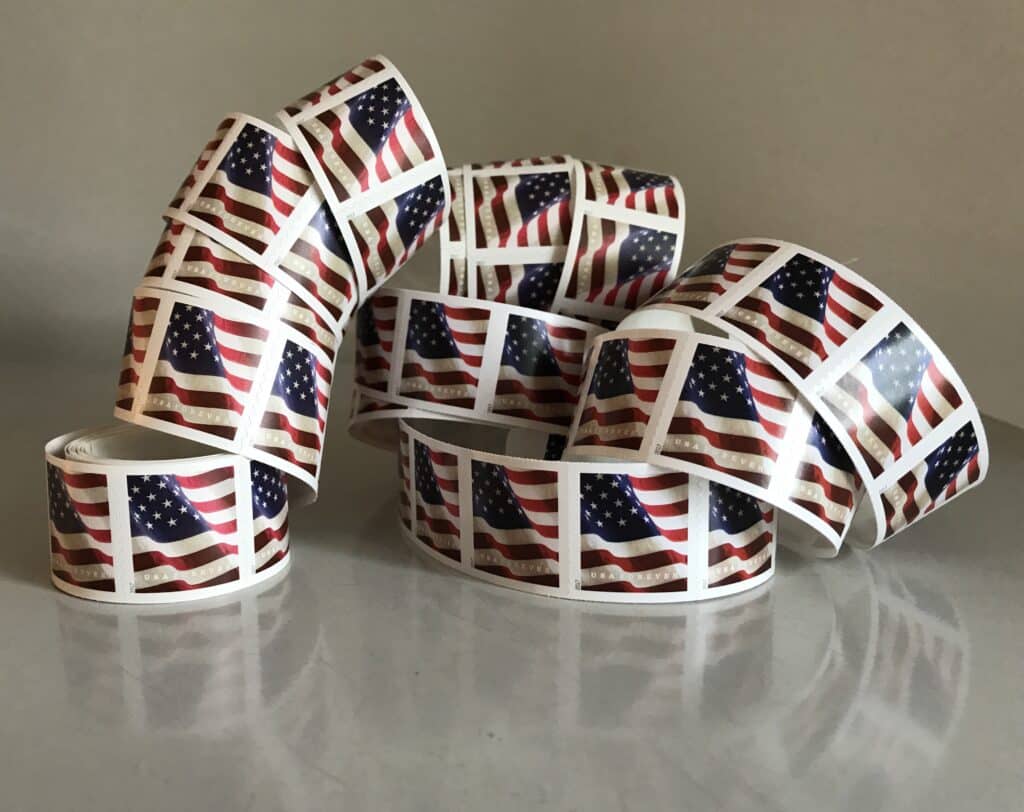 A roll of First-Class Forever Stamps depicting the American flag