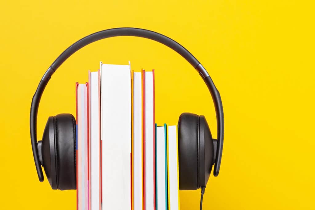 Group of books with the earphones. Audiobooks. Listen and study concept.