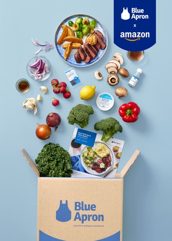 A photo of fresh ingredients going into a Blue Apron meal kit box.