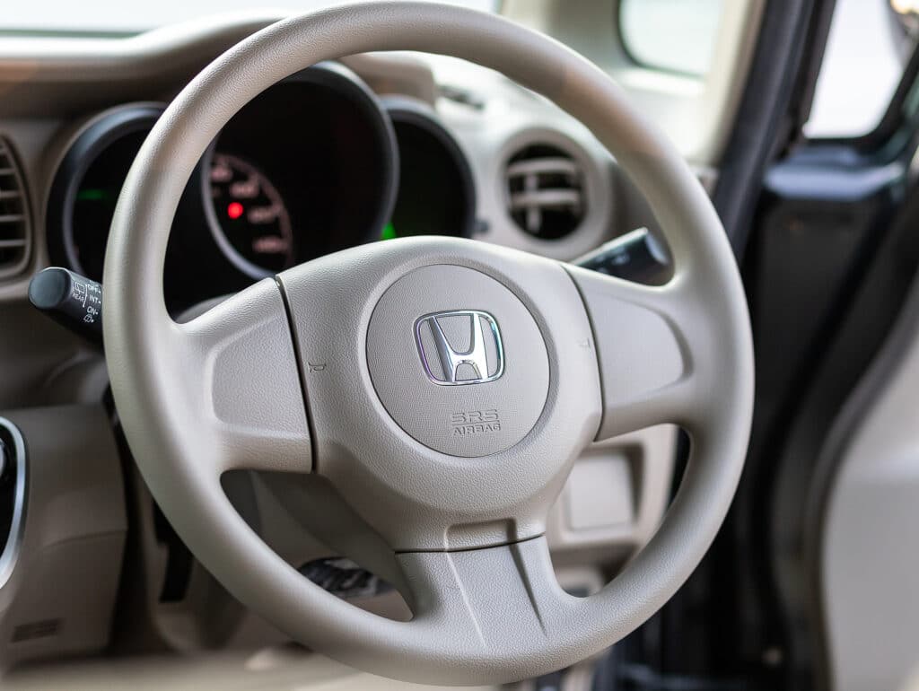 Honda N-Box, car interior view with dashboard, multifunction steering wheel, speedometer