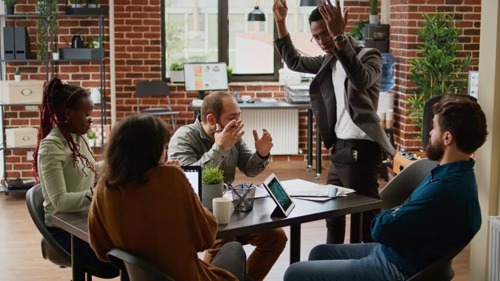 Angry frustrated boss throwing papers after team failure, having breakdown and shouting at employees. Aggressive stressed manager being furious and negative about collaboration crisis.