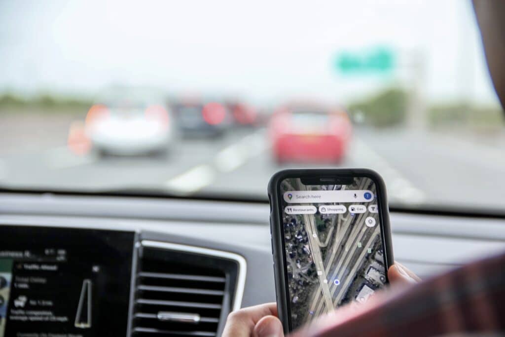 Gen Z smartphone user uses Google Maps on their iPhone.