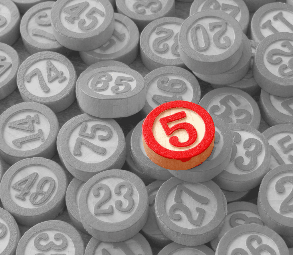 Red 5 Bingo number on top of a pile of gray numbers