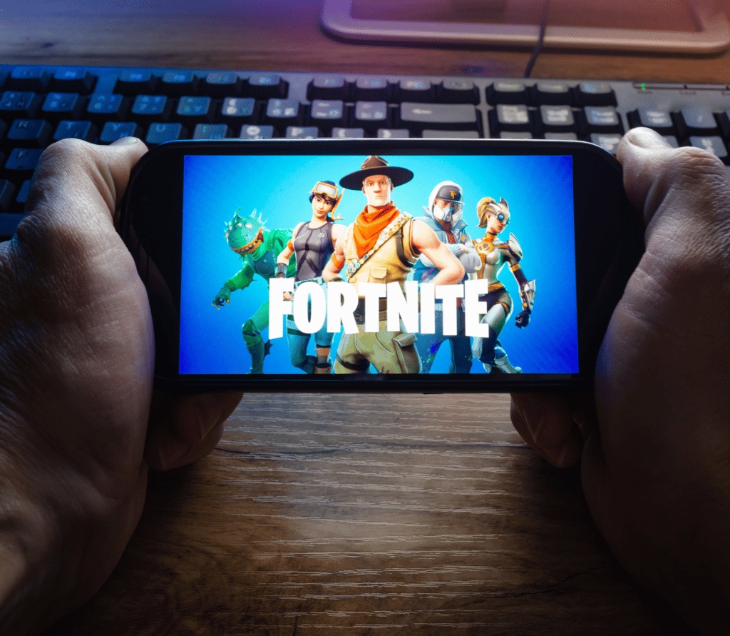 Person playing Fortnite on a smartphone