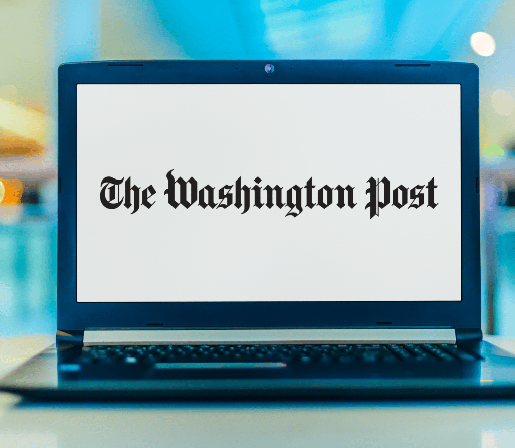 The Washington Post logo on a laptop with an aqua background behind the laptop.