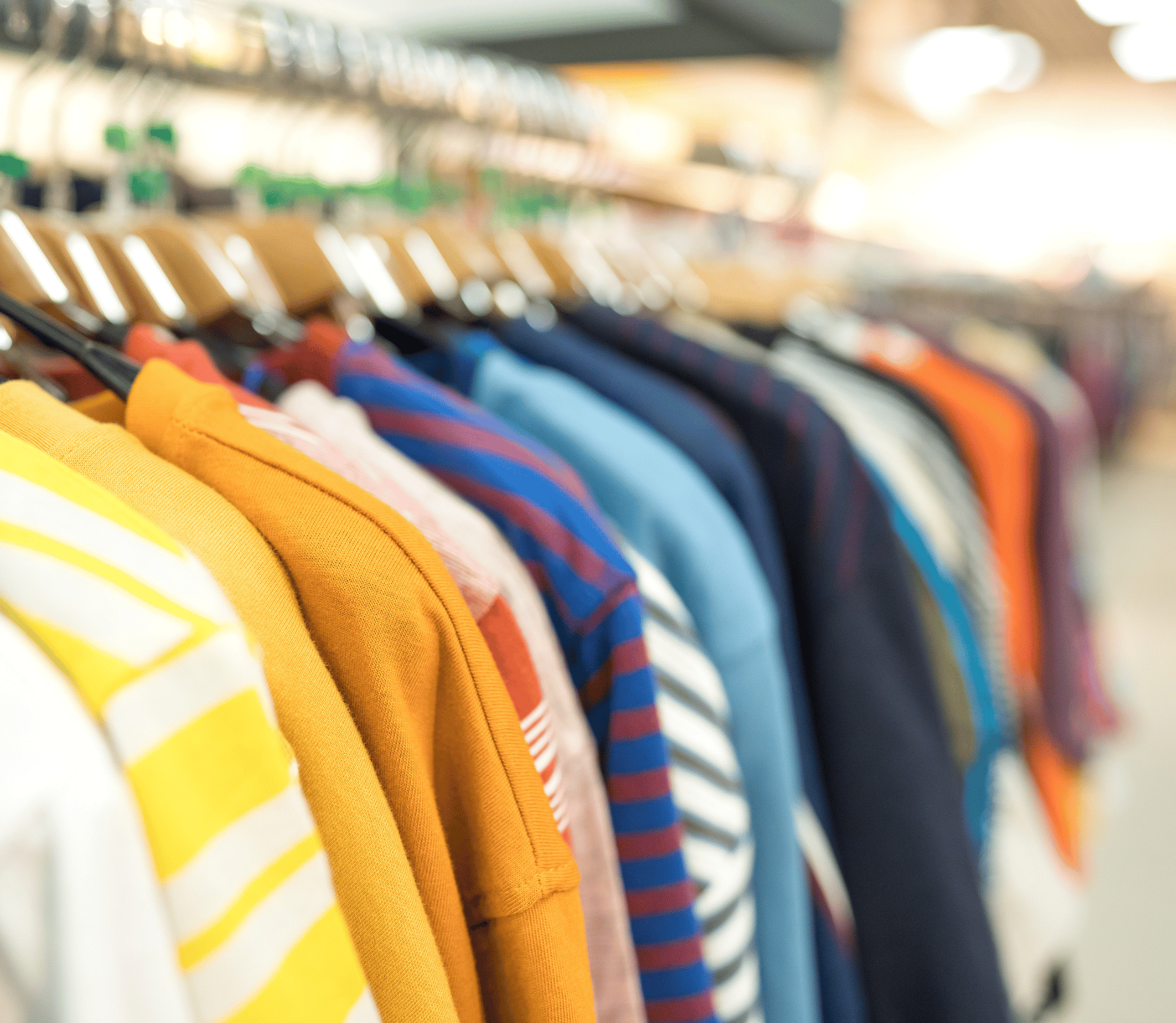 Rack of fashionable clothes hanging on hangers