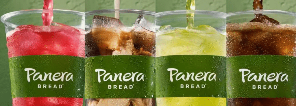 Four beverages from Panera's Unlimited Sip Club in front of green background