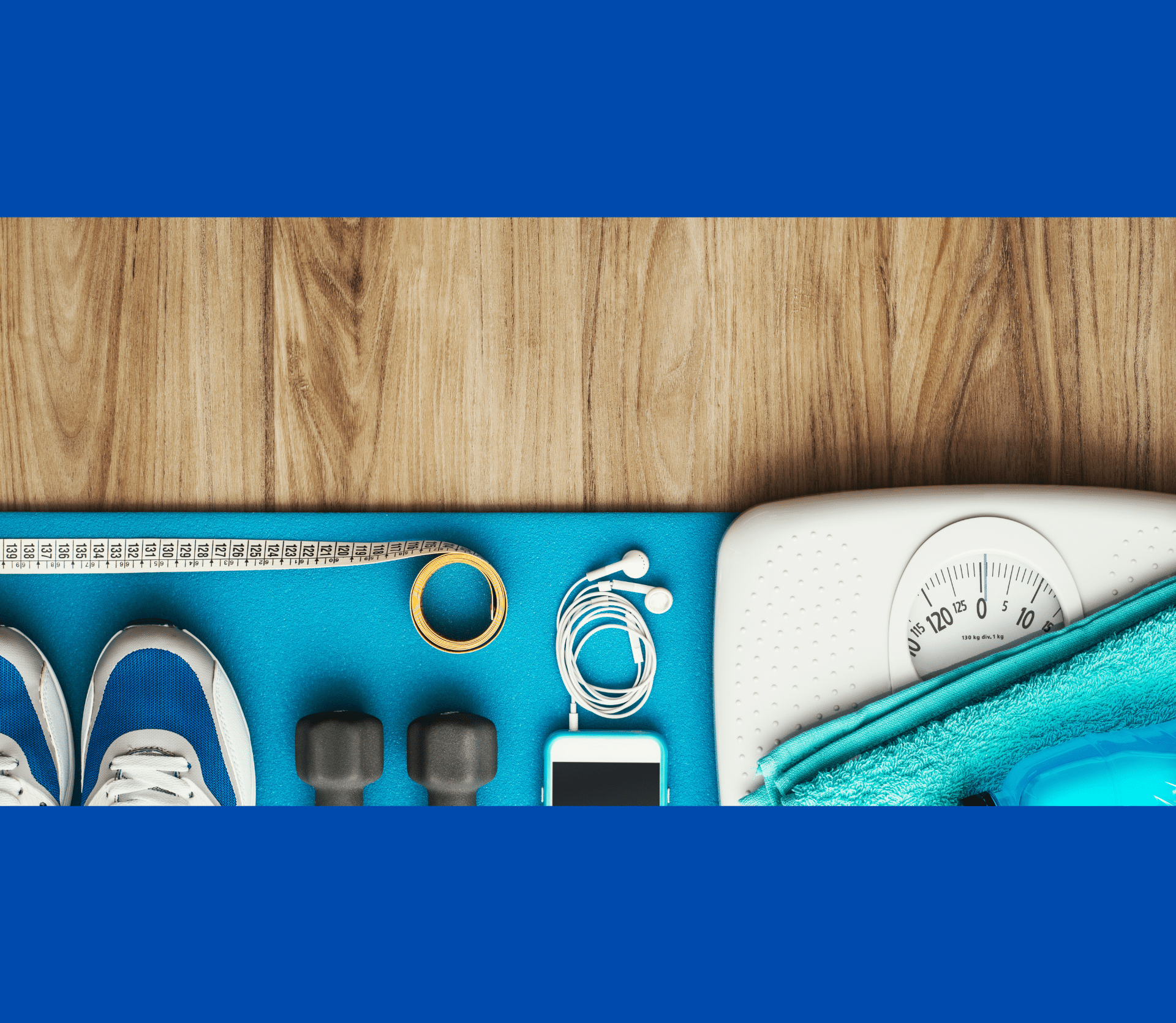 Weight loss gear (shoes, weights, tape measure, water bottle and scale) placed next to each other on a wooden floor