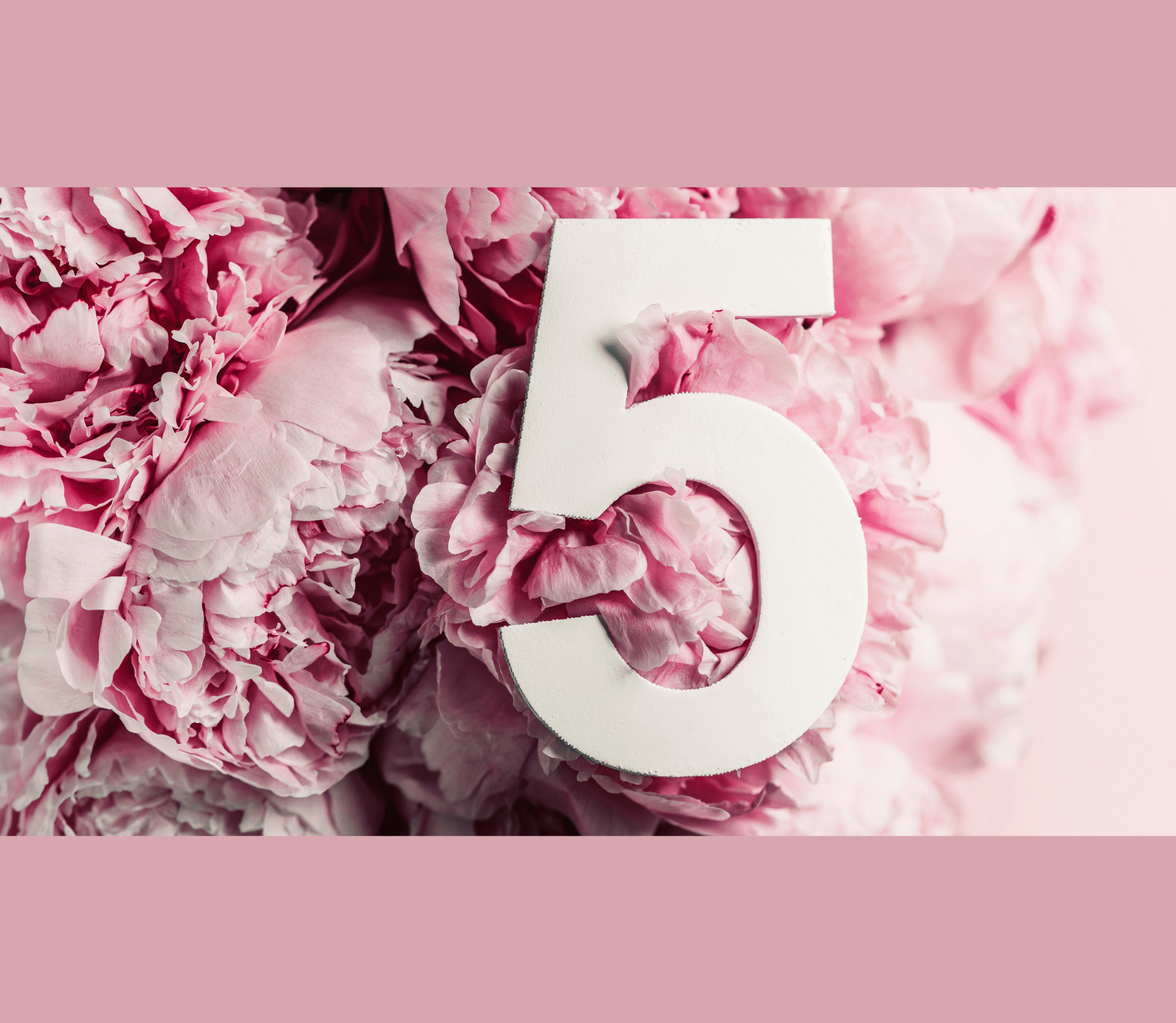 White number 5 superimposed on a bed of pink and white peonies.