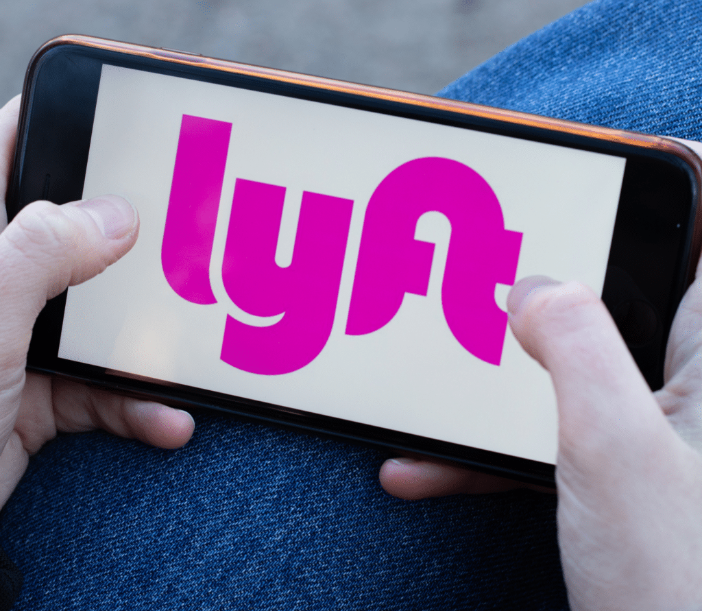 Lyft ride sharing app logo close-up displayed on a smartphone