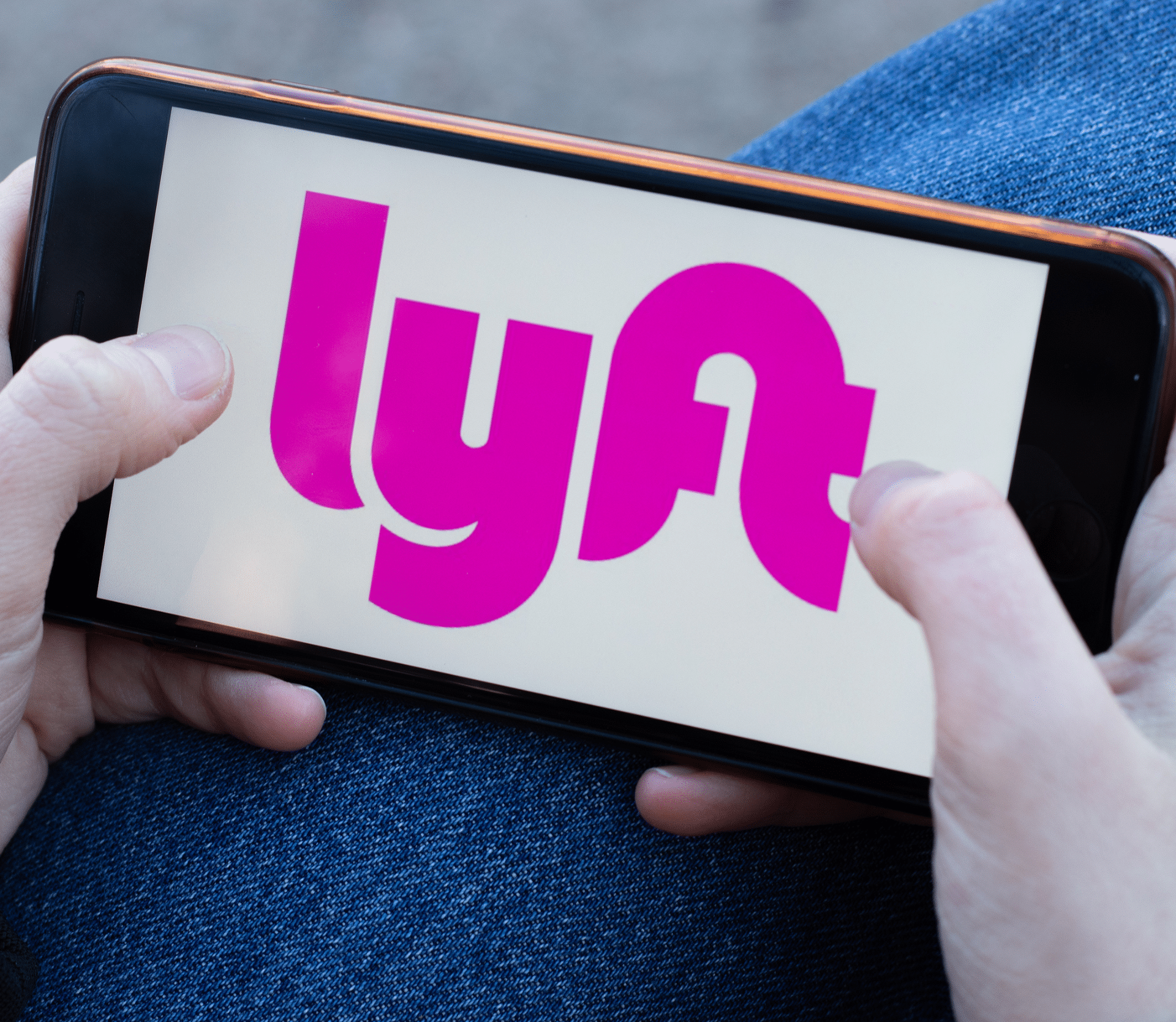 Lyft ride sharing app logo close-up displayed on a smartphone