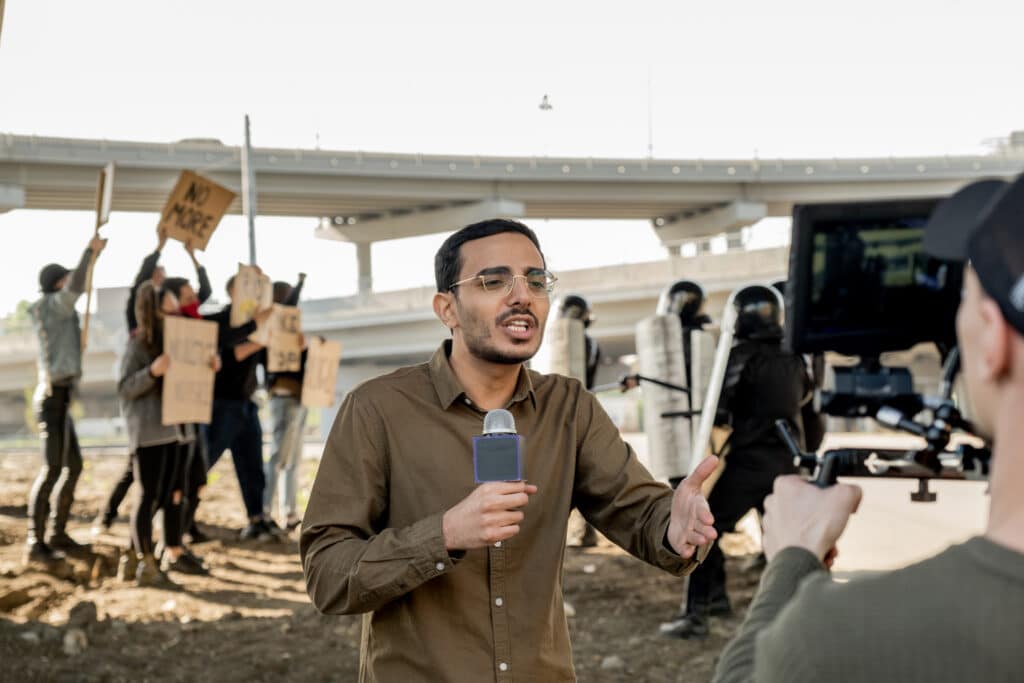 Reporter covering riot in city