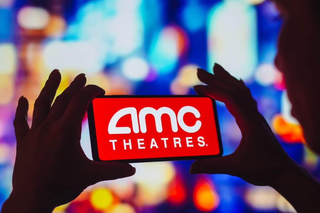 In this photo illustration, the AMC Theatres logo is displayed on a smartphone screen