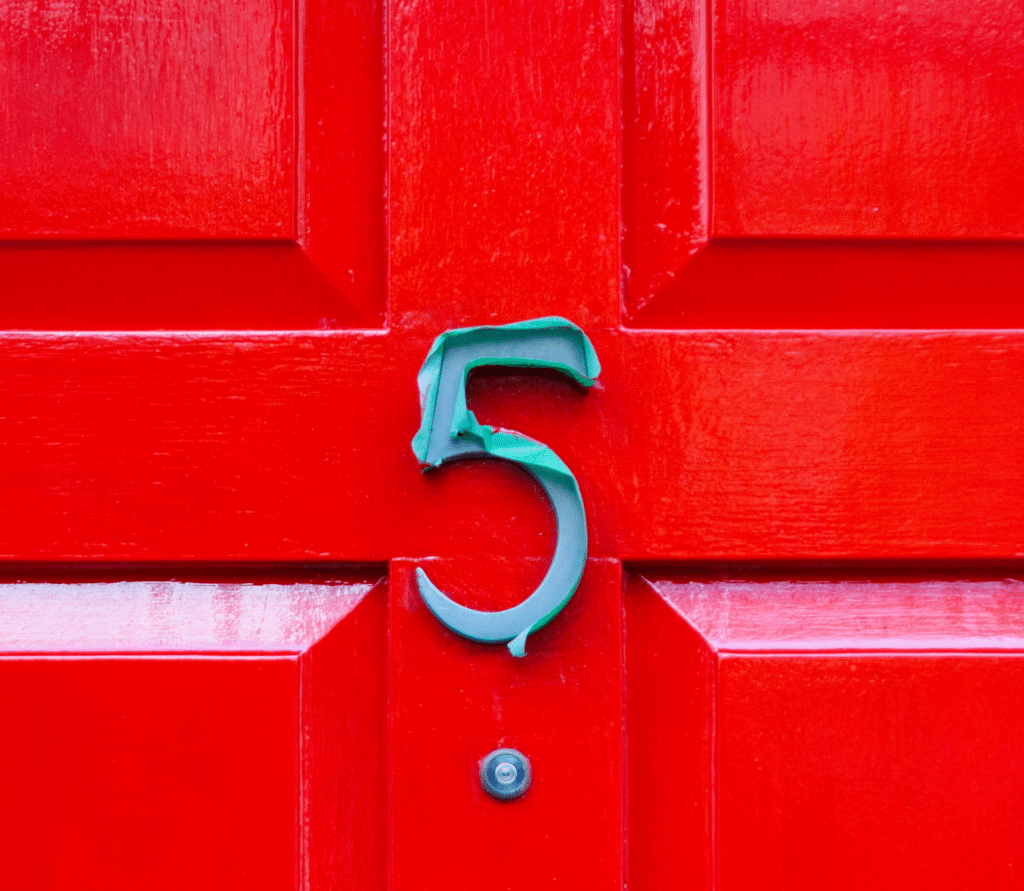 Green 5 on bright red door