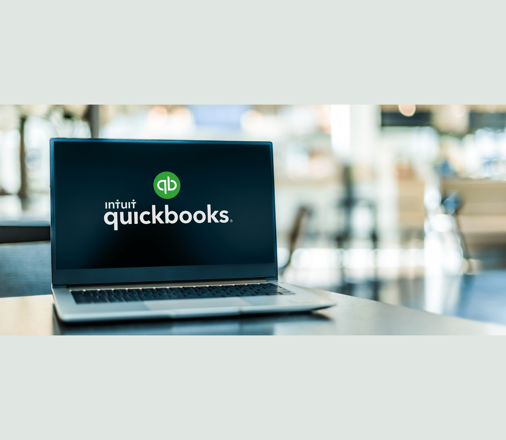 Laptop displaying the Intuit QuickBooks logo