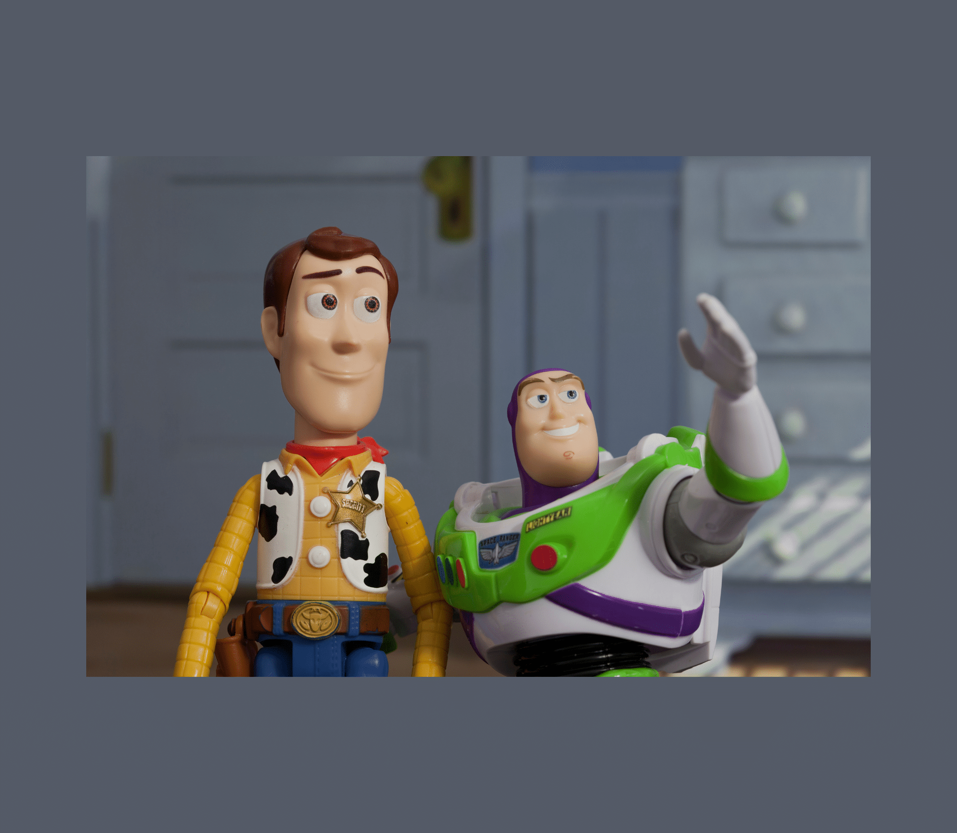 Woody and Buzz Lightyear from Toy Story gazing toward the sky