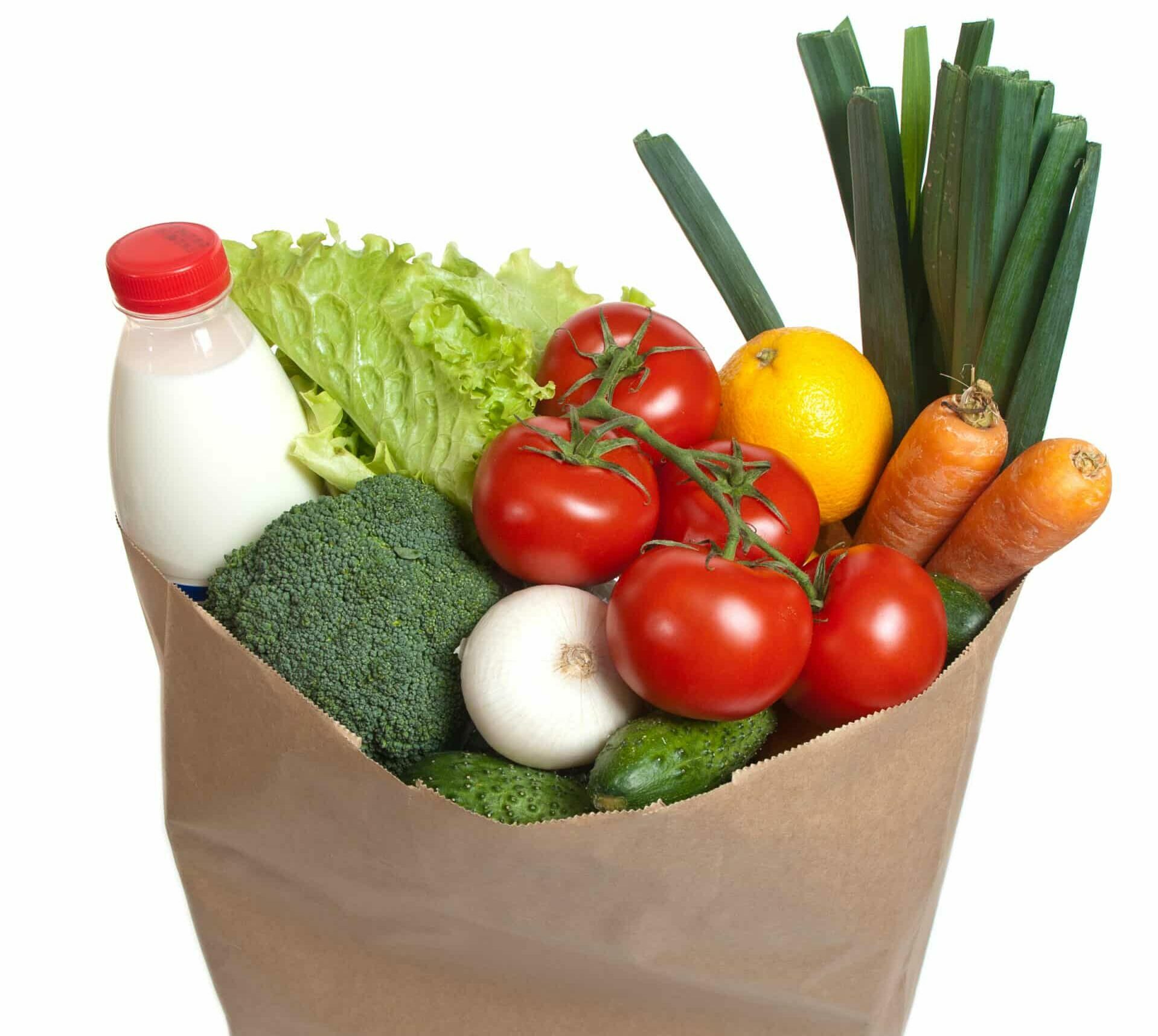 Bag full of vegetables, isolated on white